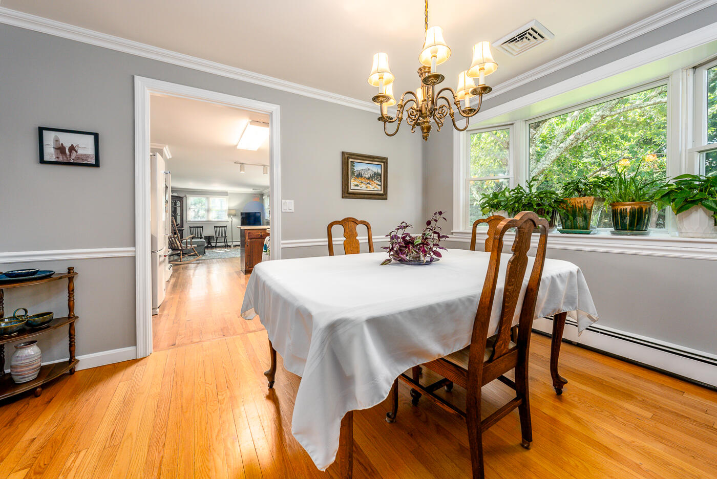 41 Joyce Anne Road Centerville, MA 02632 - Photo 9 of 33 a view of a dining room with furniture a chandelier and wooden floor