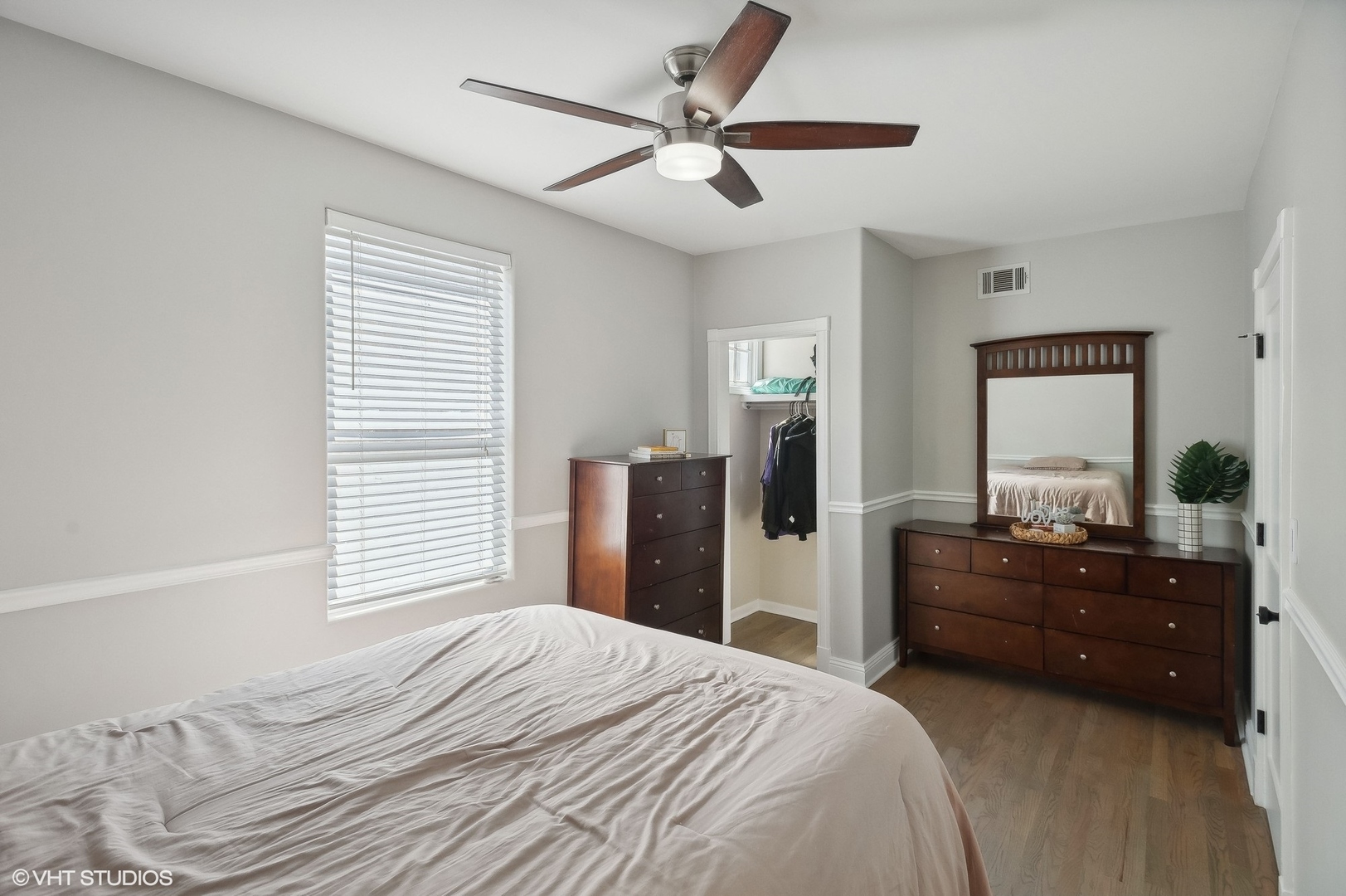 2949 North Rutherford Avenue Chicago, IL 60634 - Photo 15 of 23 a bedroom with a bed and a dresser