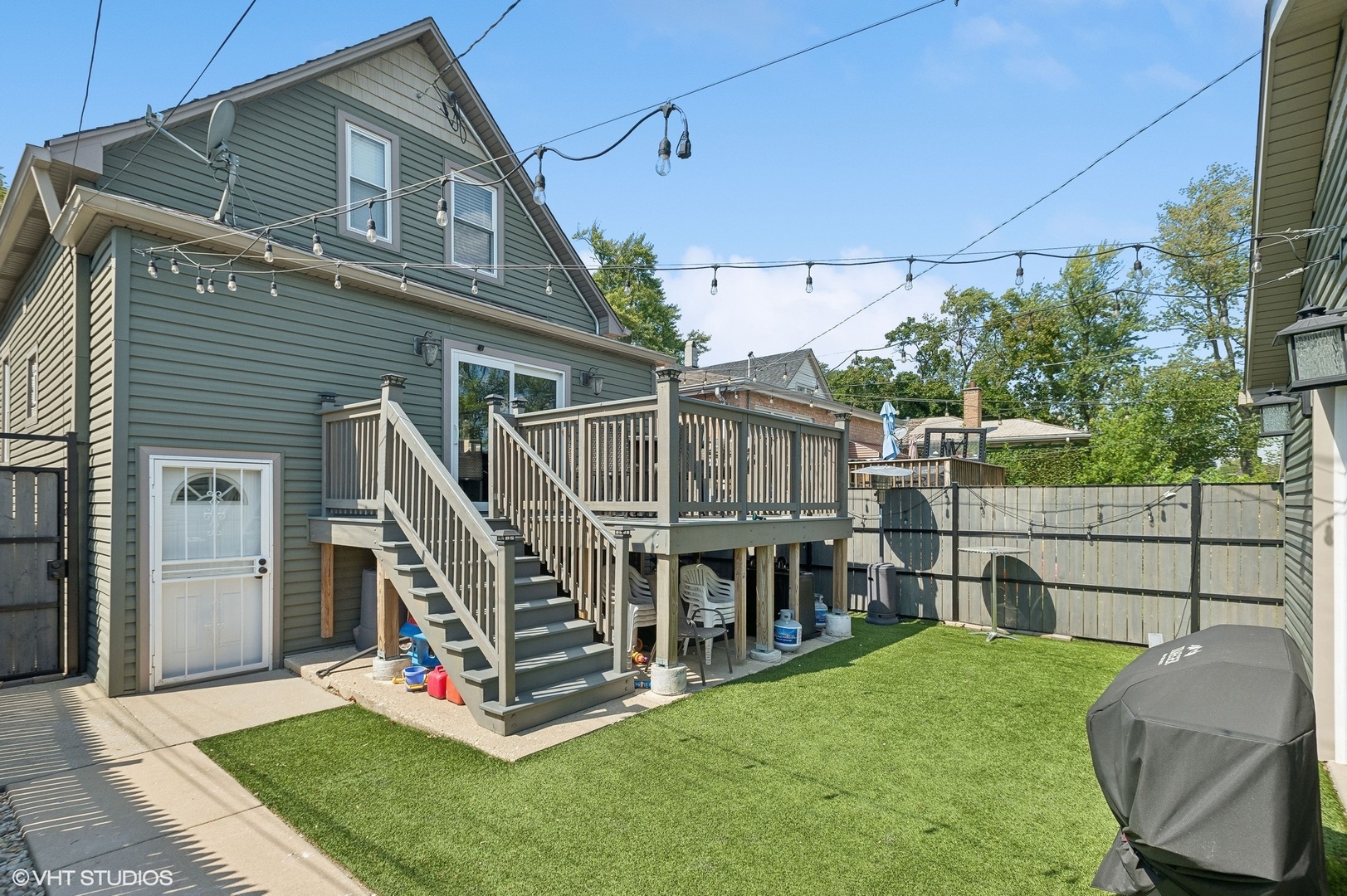 2949 North Rutherford Avenue Chicago, IL 60634 - Photo 17 of 23 a view of a deck with a big yard and large trees