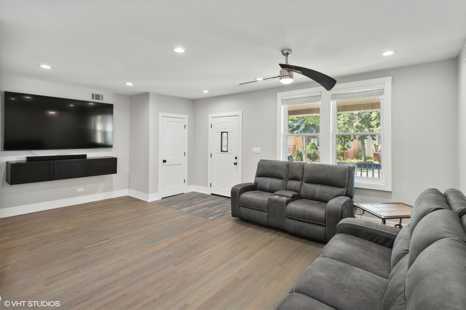 2949 North Rutherford Avenue Chicago, IL 60634 - Photo 2 of 23 a living room with furniture and a flat screen tv