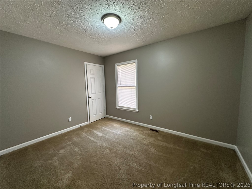 2678 Rivercliff Road Fayetteville, NC 28301 - Photo 12 of 19 an empty room with windows