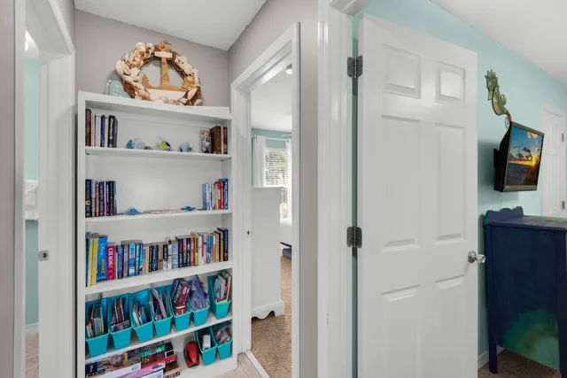 a bedroom with a large bed and a painting on the wall