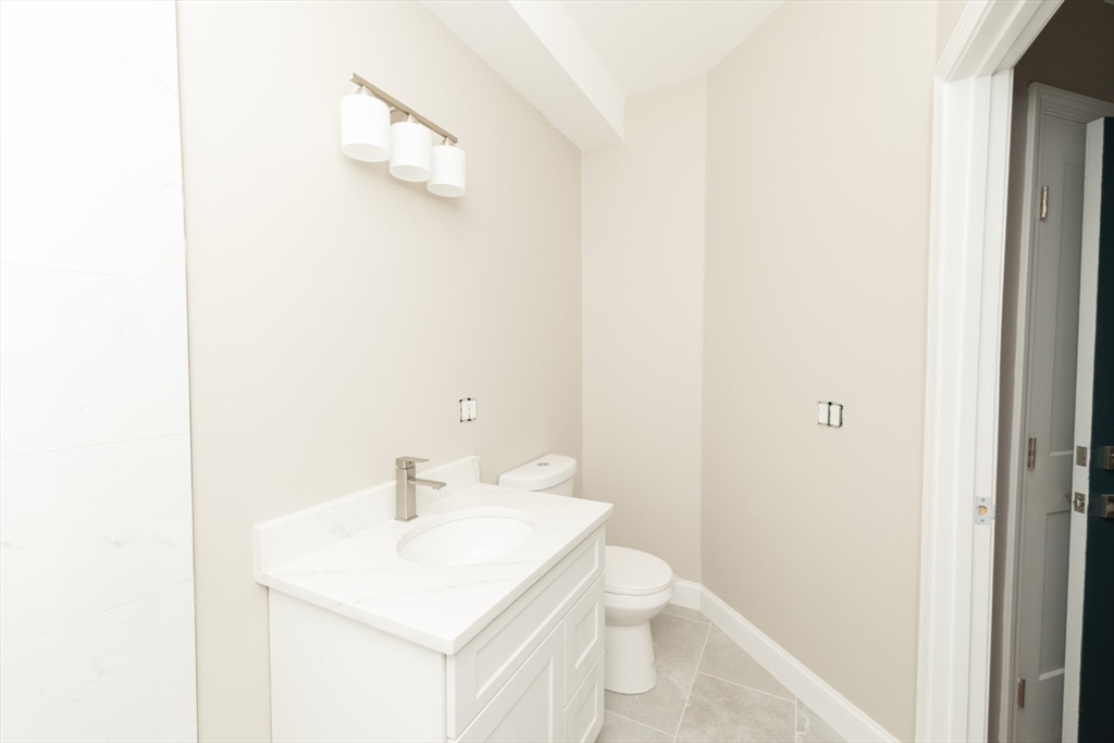 13 Nahant Street, Unit 2D Lynn, MA 01902 - Photo 7 of 11 a bathroom with a sink and a toilet
