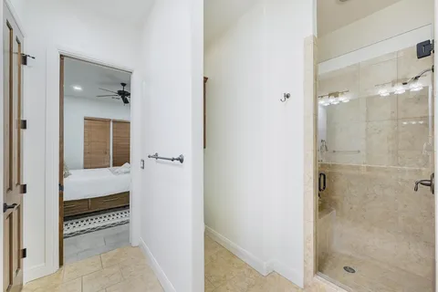 a bathroom with a shower and a sink