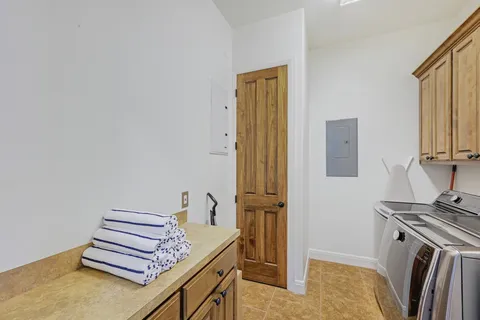 a view of a livingroom with furniture and staircase
