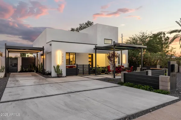 a kitchen with stainless steel appliances granite countertop a sink a stove a refrigerator and island