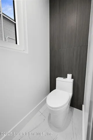 an empty room with a empty space and window