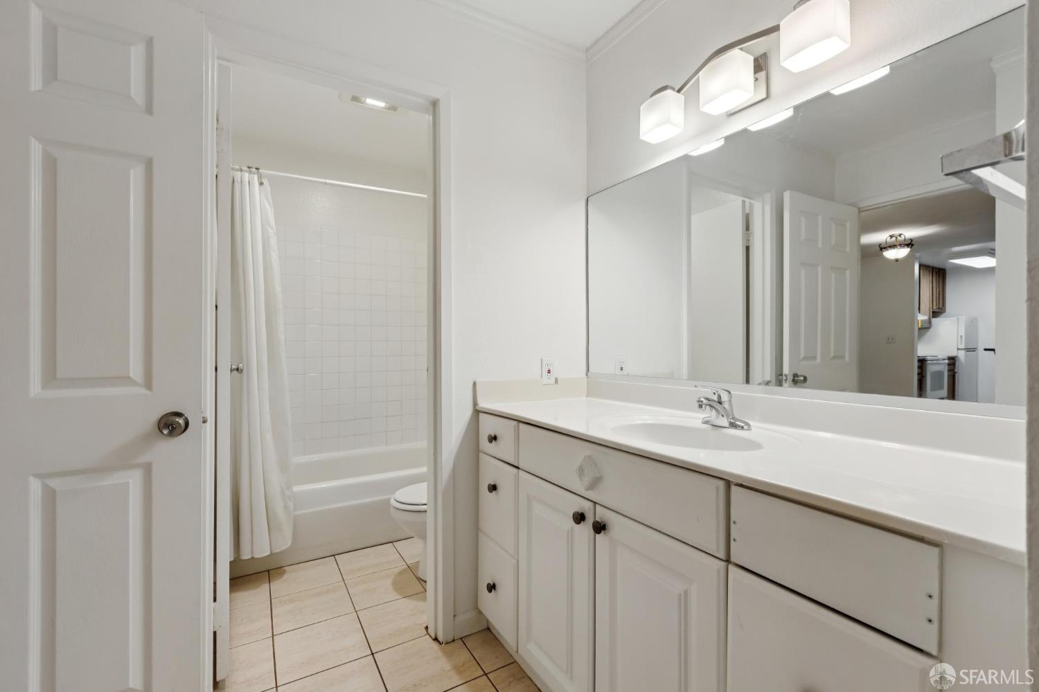 368 Imperial Way, Unit 233 Daly City, CA 94015 - Photo 16 of 39 a bathroom with a sink a vanity and a mirror