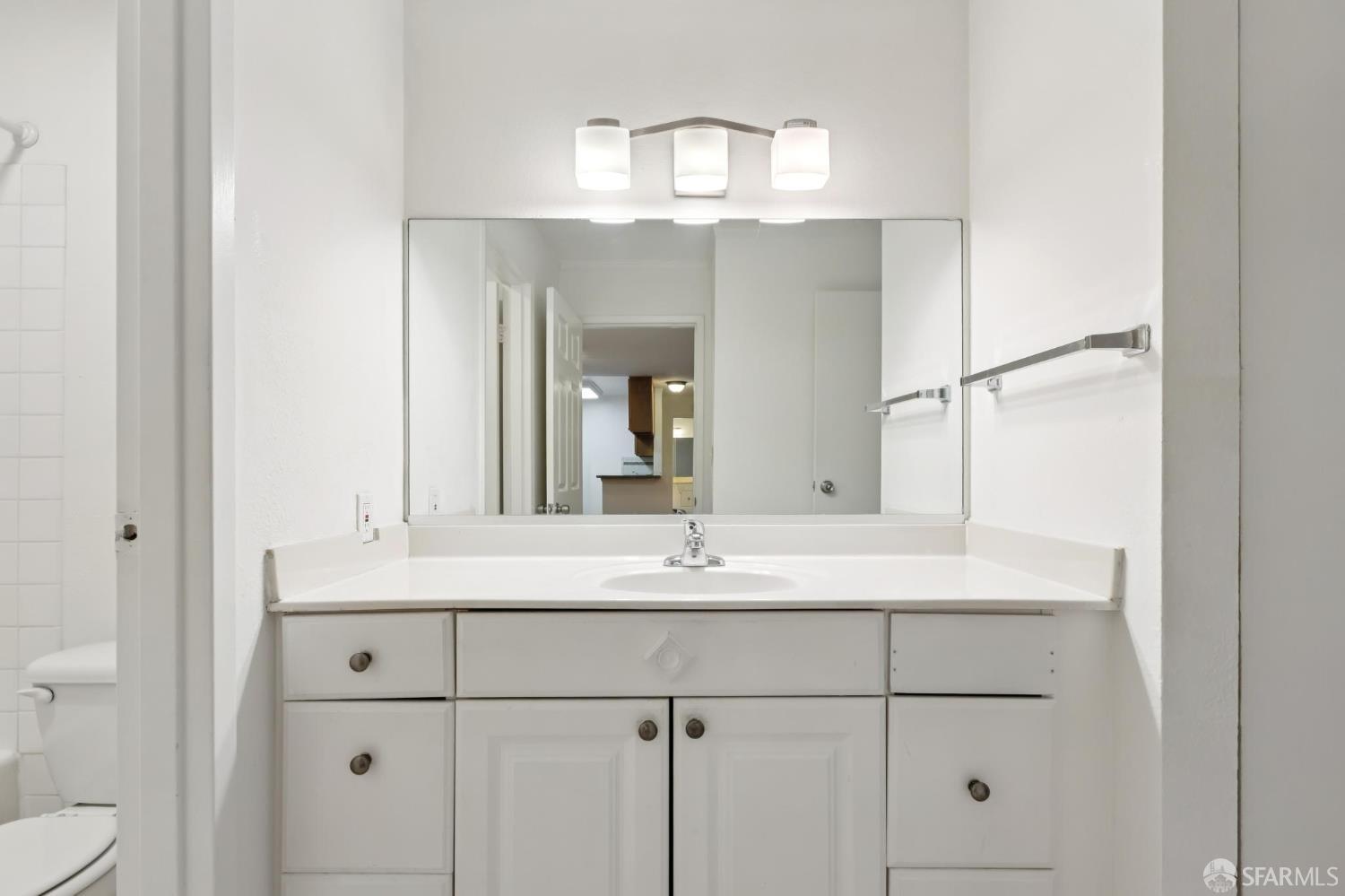 368 Imperial Way, Unit 233 Daly City, CA 94015 - Photo 17 of 39 a bathroom with a sink and a mirror