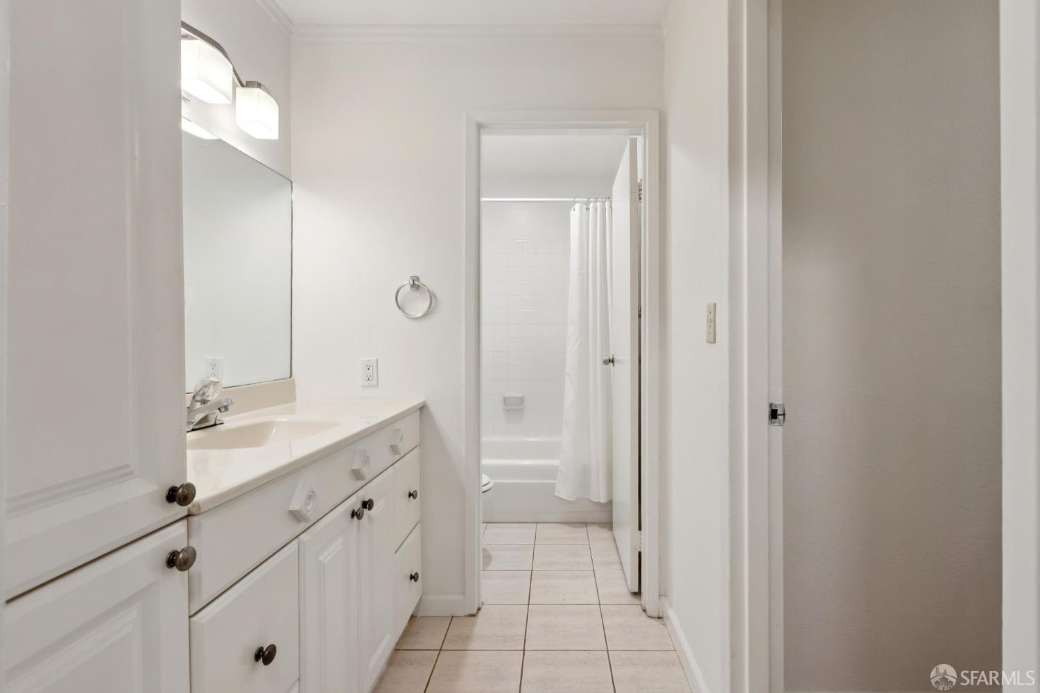 368 Imperial Way, Unit 233 Daly City, CA 94015 - Photo 19 of 39 a spacious bathroom with a granite countertop sink and a mirror