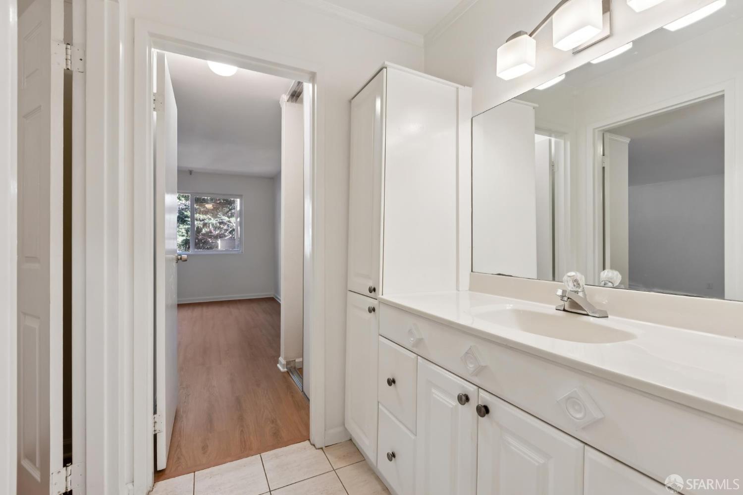 368 Imperial Way, Unit 233 Daly City, CA 94015 - Photo 20 of 39 a bathroom with a double vanity sink and mirror