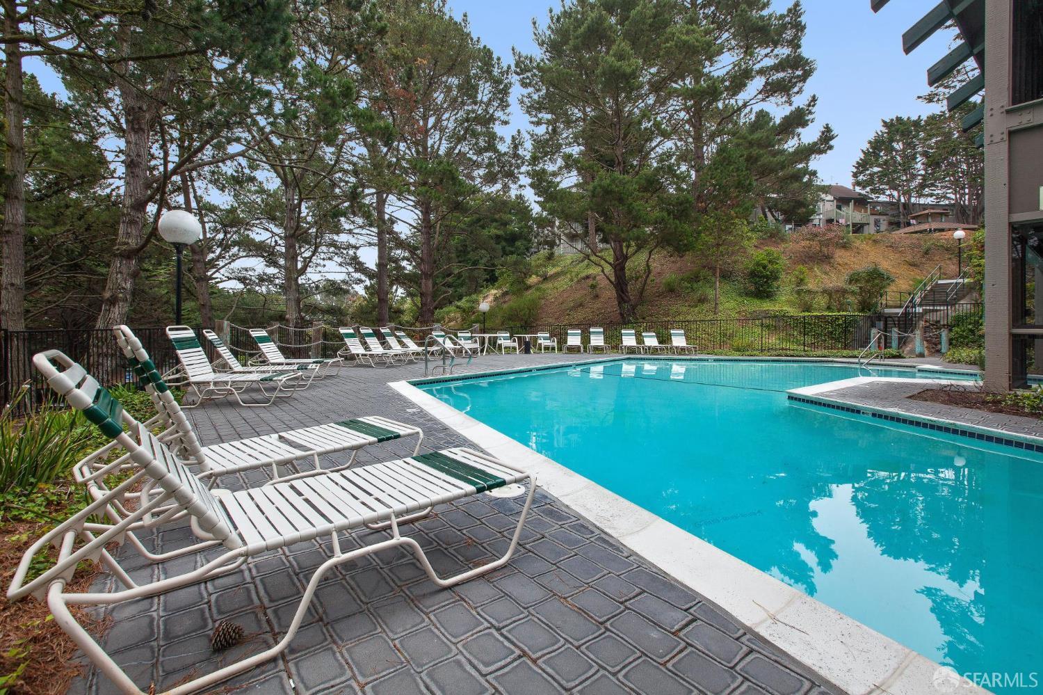 368 Imperial Way, Unit 233 Daly City, CA 94015 - Photo 33 of 39 a view of a swimming pool with a patio and a yard