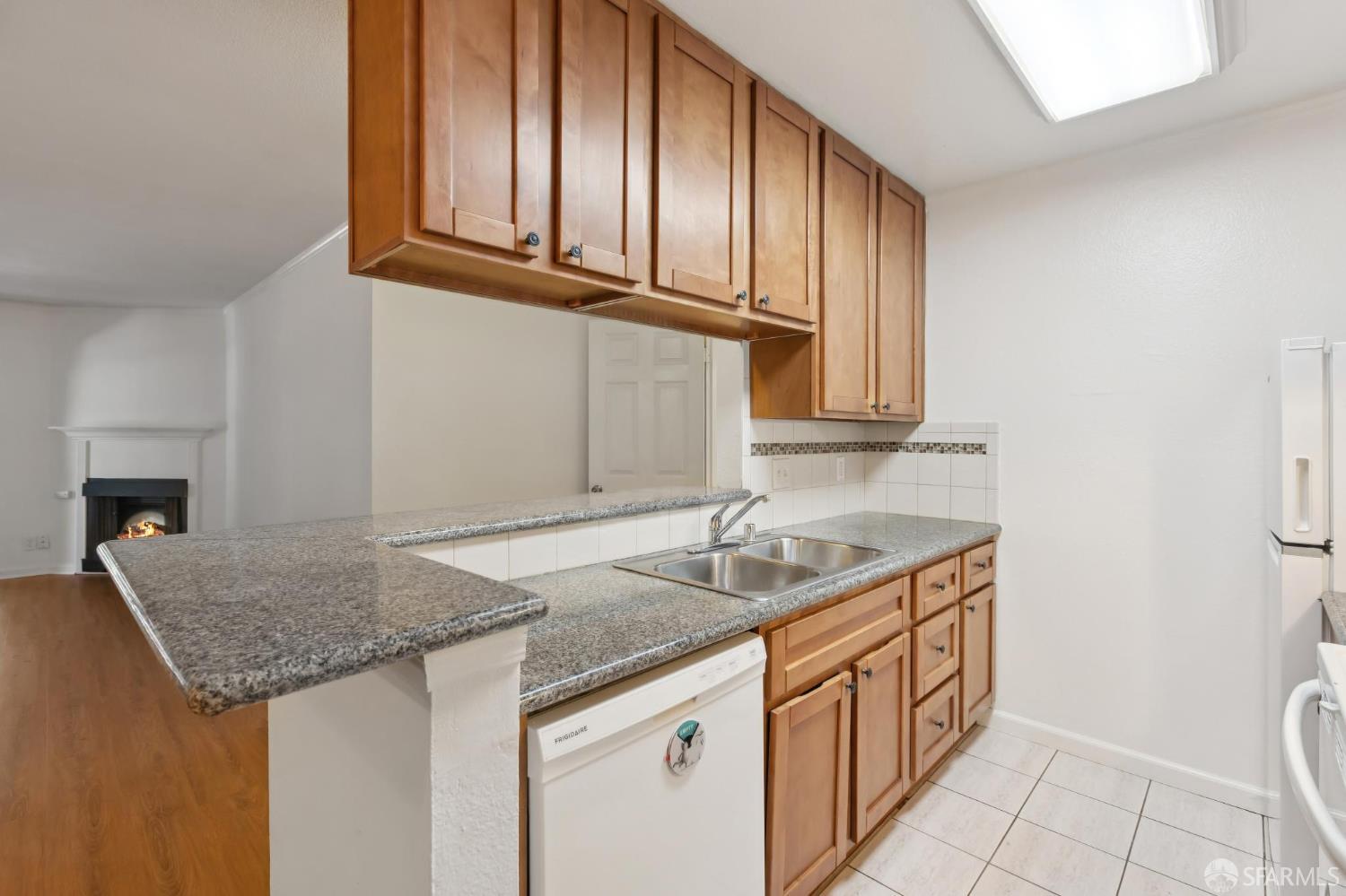 368 Imperial Way, Unit 233 Daly City, CA 94015 - Photo 7 of 39 a kitchen with stainless steel appliances granite countertop a sink and cabinets