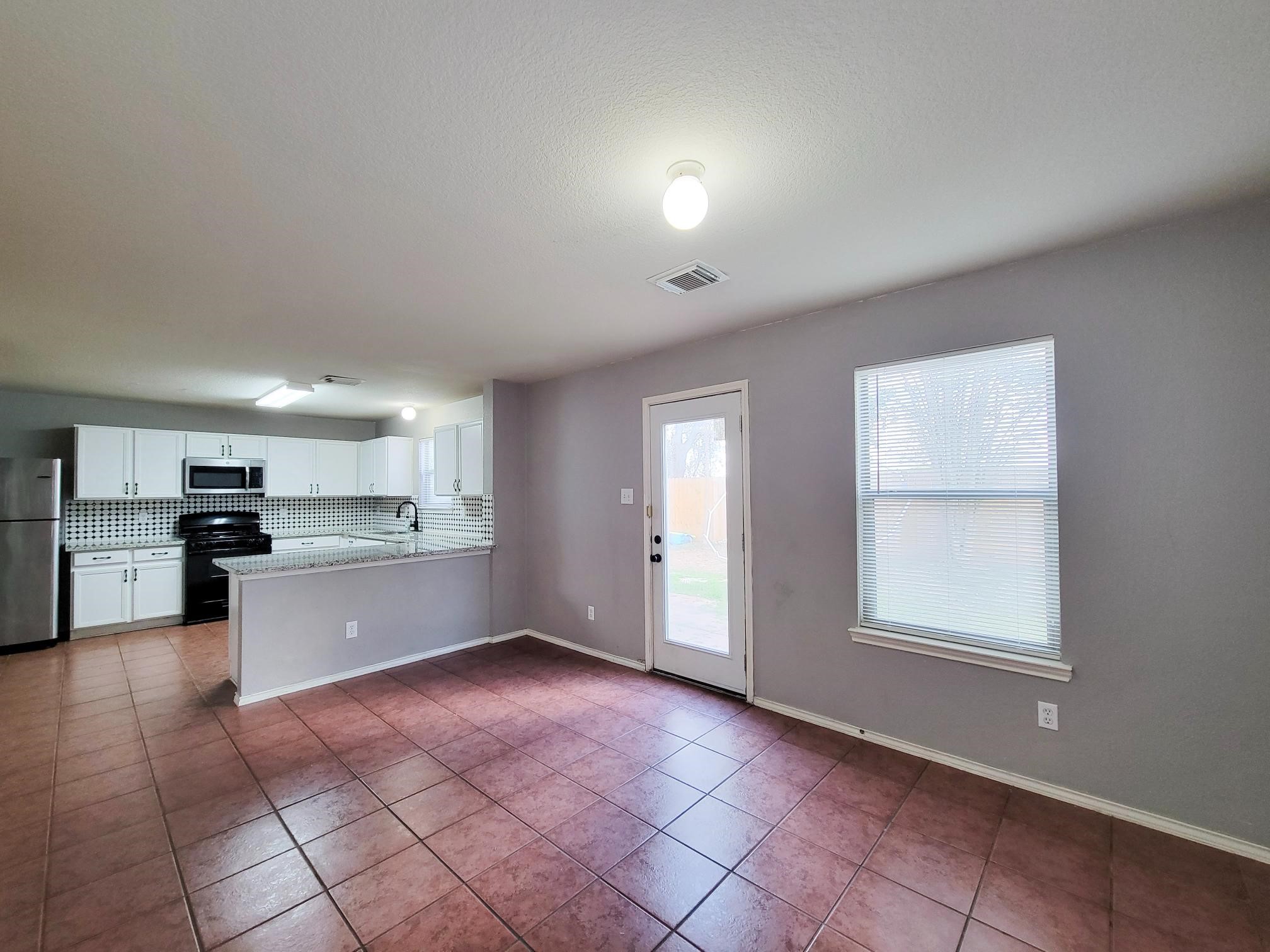 16306 Kendons Way Lane Cypress, TX 77429 - Photo 12 of 39 a large kitchen with a large window