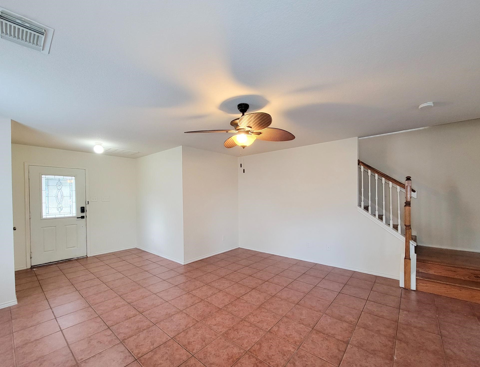 16306 Kendons Way Lane Cypress, TX 77429 - Photo 16 of 39 a bedroom with a bed and a chandelier