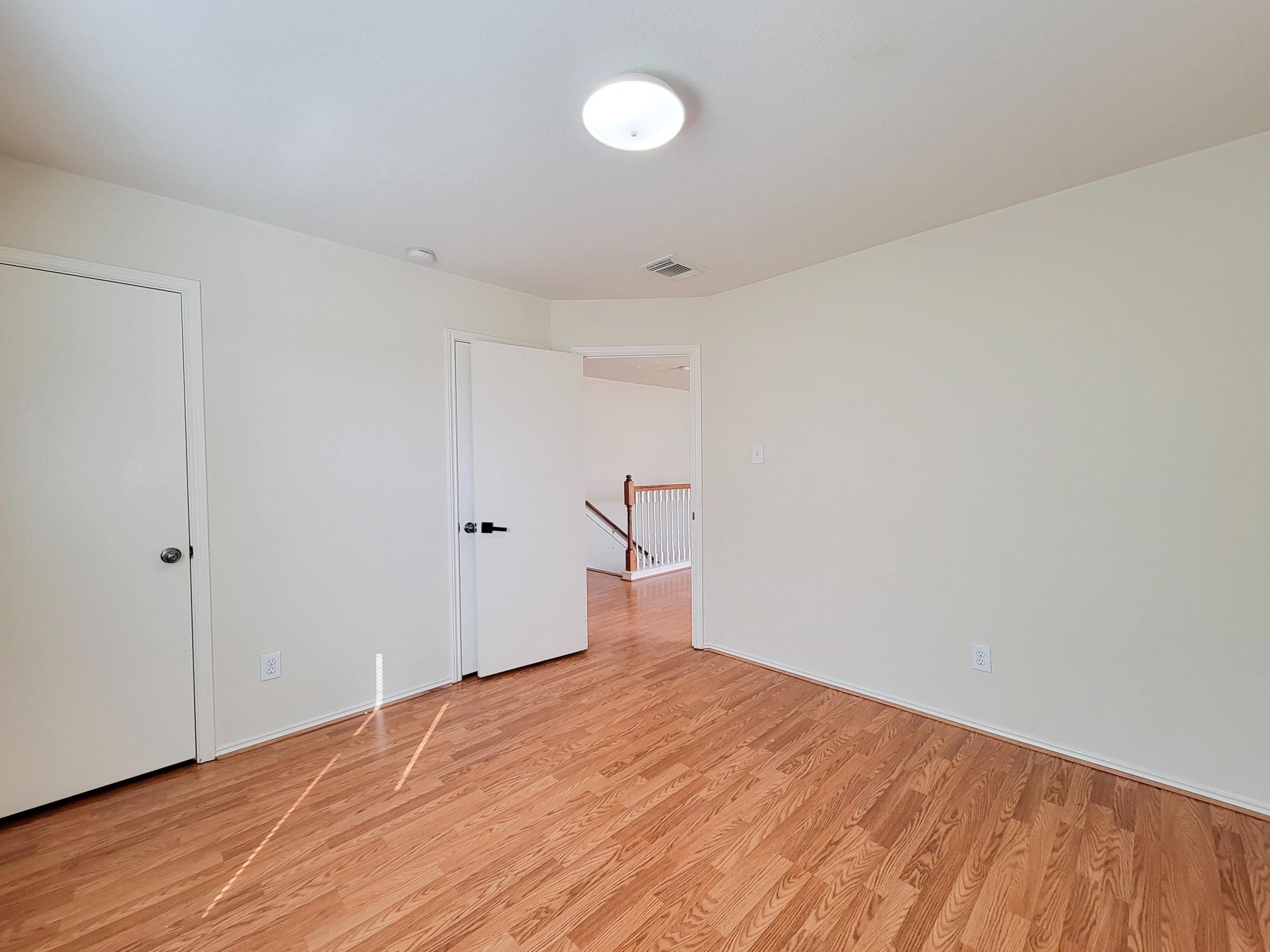 16306 Kendons Way Lane Cypress, TX 77429 - Photo 24 of 39 a view of empty room with wooden floor