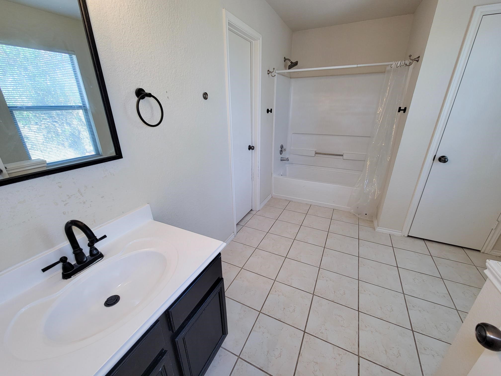 16306 Kendons Way Lane Cypress, TX 77429 - Photo 29 of 39 a bathroom with a sink and a mirror