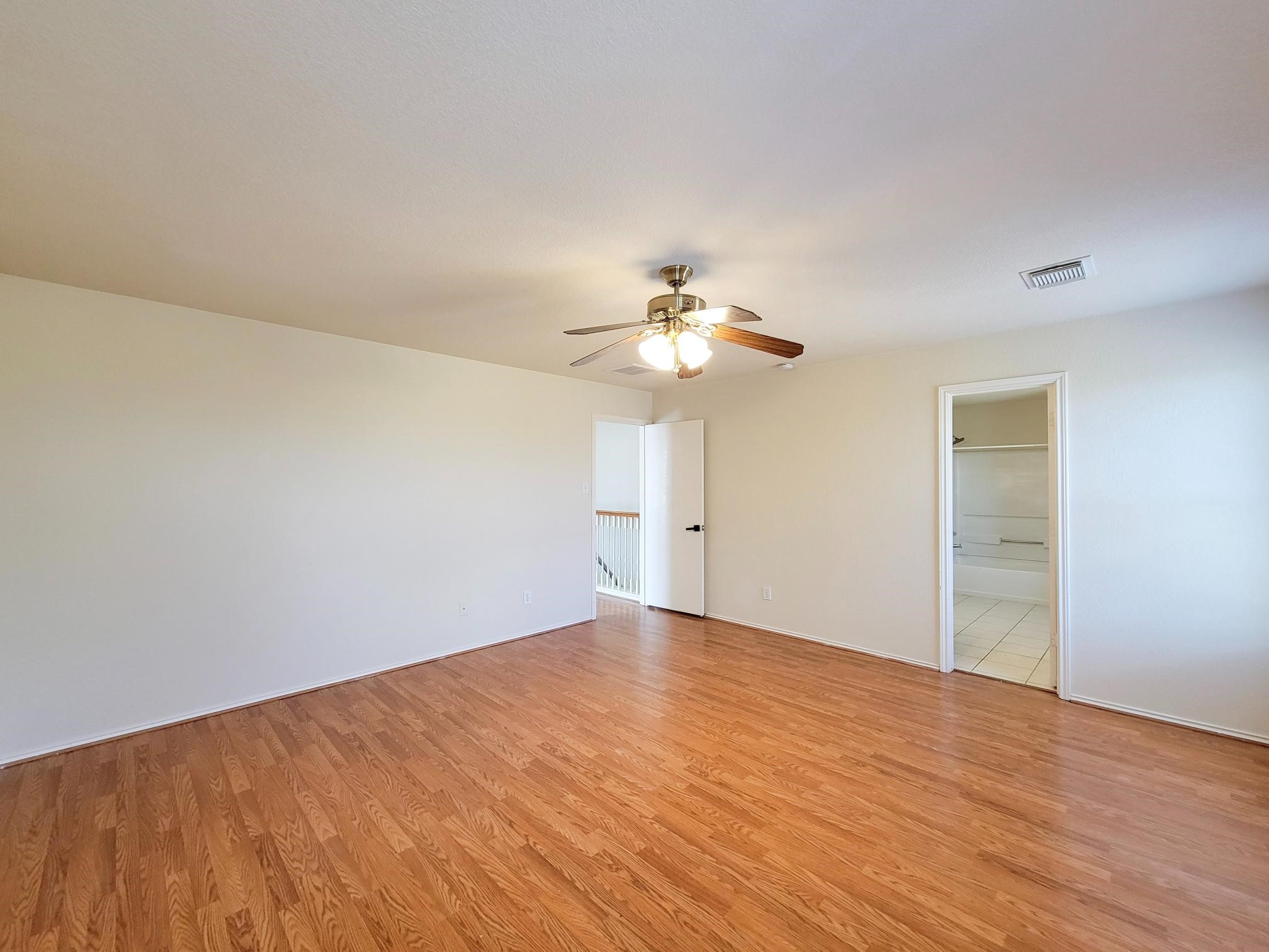 16306 Kendons Way Lane Cypress, TX 77429 - Photo 30 of 39 a view of an empty room with wooden floor