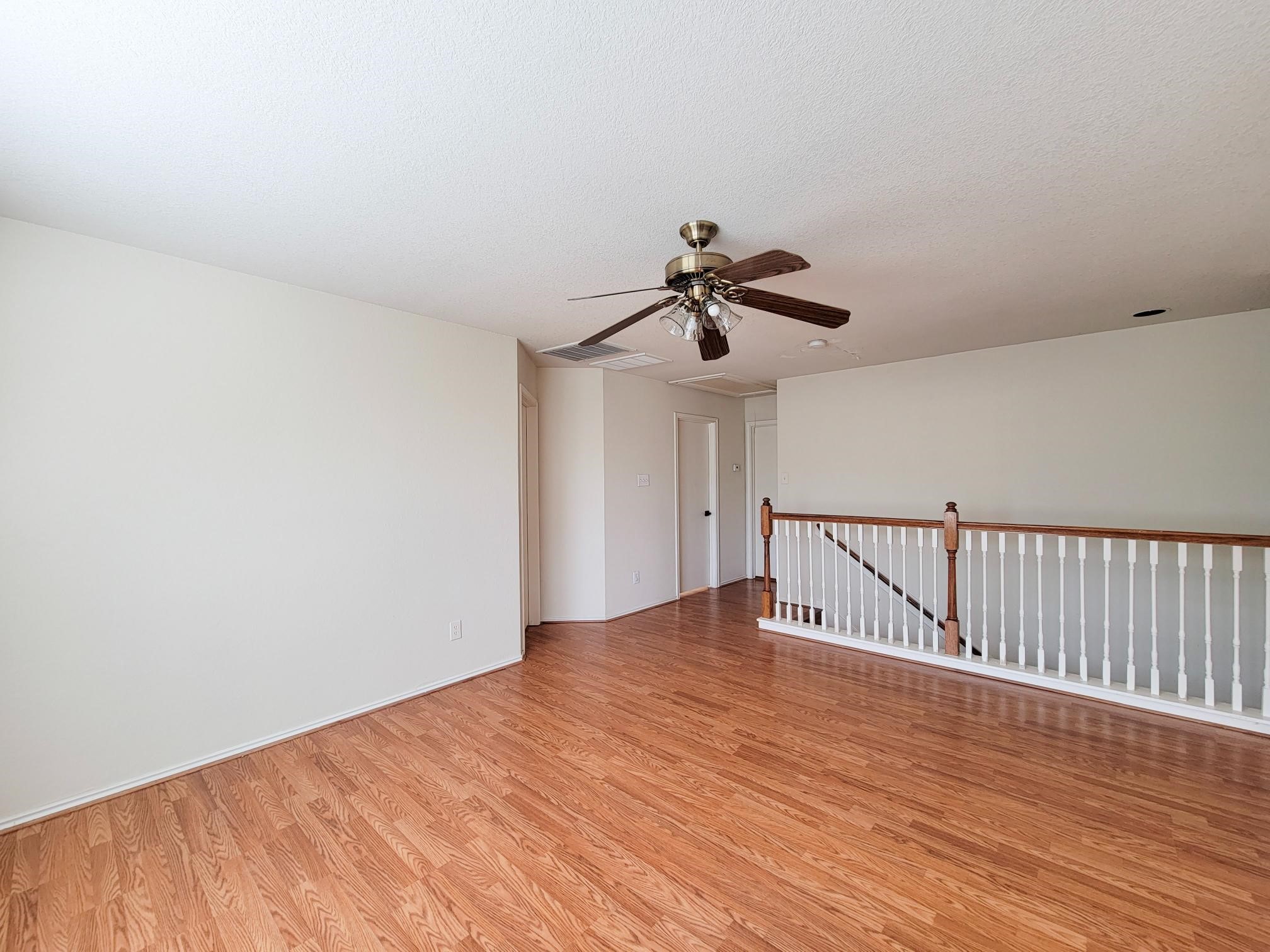16306 Kendons Way Lane Cypress, TX 77429 - Photo 32 of 39 a view of an empty room with wooden floor