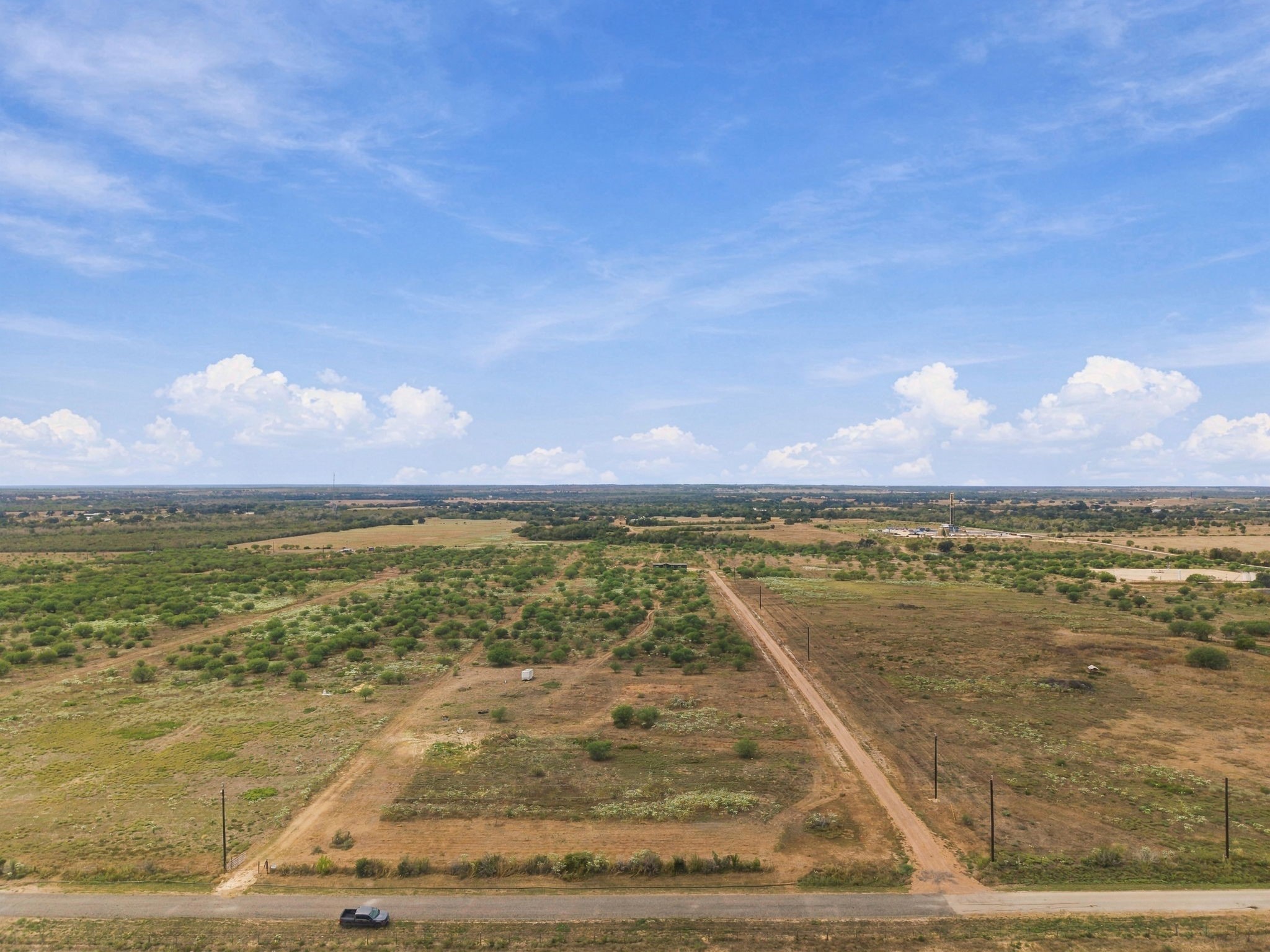 3898 Concrete-Edgar Road Cuero, TX 77954 - Photo 3 of 9 Featuring excellent road frontage, clear perimeter lines, and nearby power lines under bright, clear skies, this parcel is fully primed for your custom build, agricultural venture, or long-term portfolio.