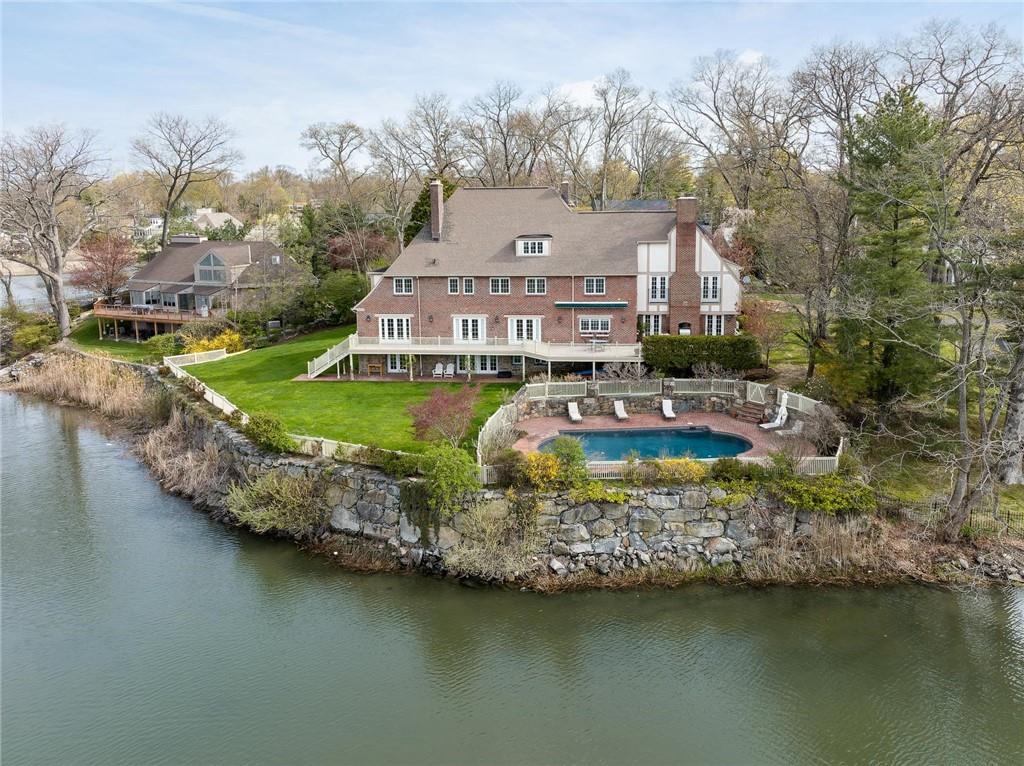 40 Lake Road Rye, NY 10580 - Photo 1 of 1 an aerial view of a house with swimming pool patio and lake view