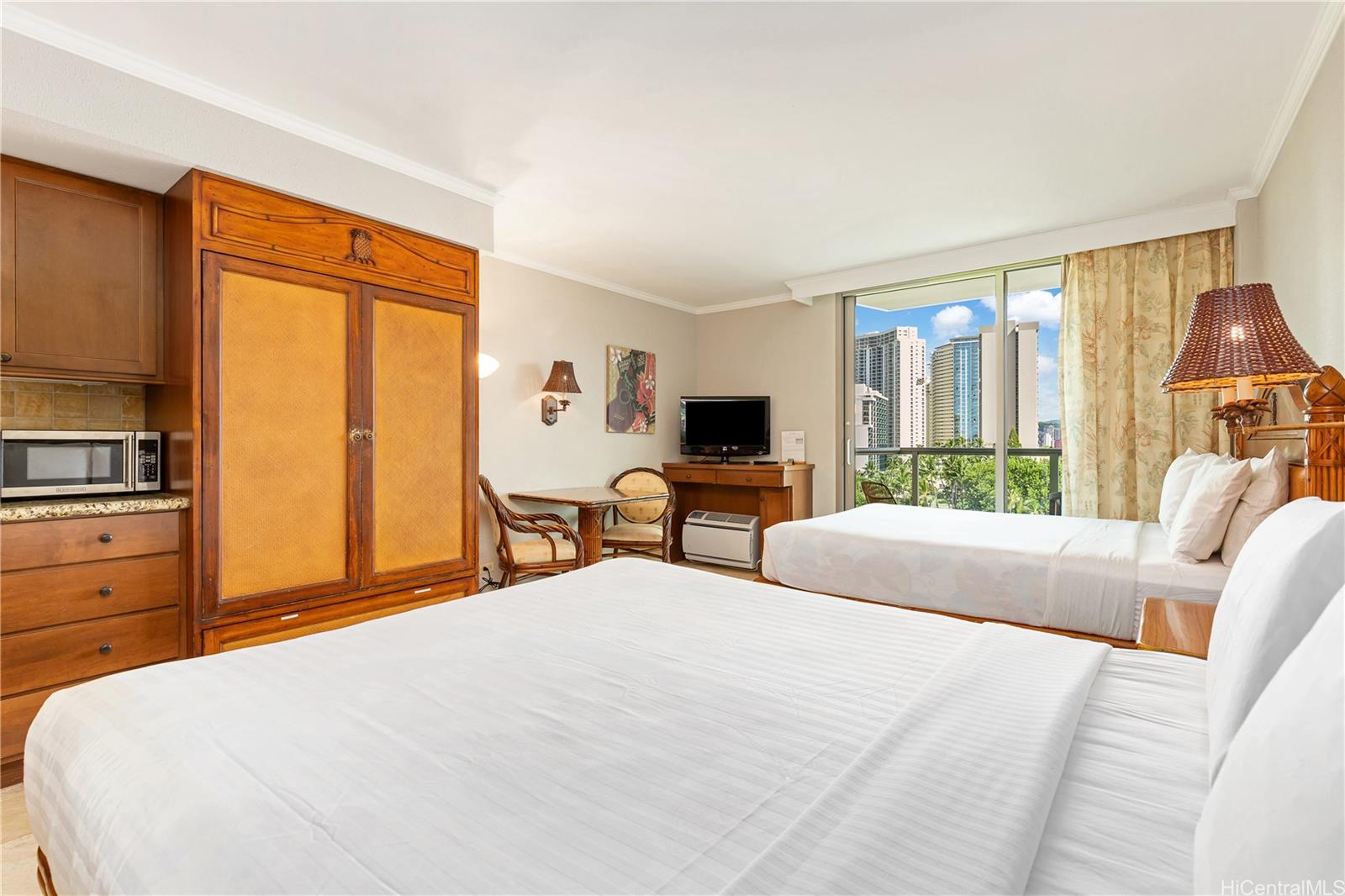 2045 Kalakaua Avenue, Unit 604 Honolulu, HI 96815 - Photo 3 of 24 a bedroom with a bed a large window and flat screen tv