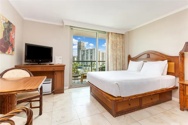 a bedroom with a bed and flat screen tv