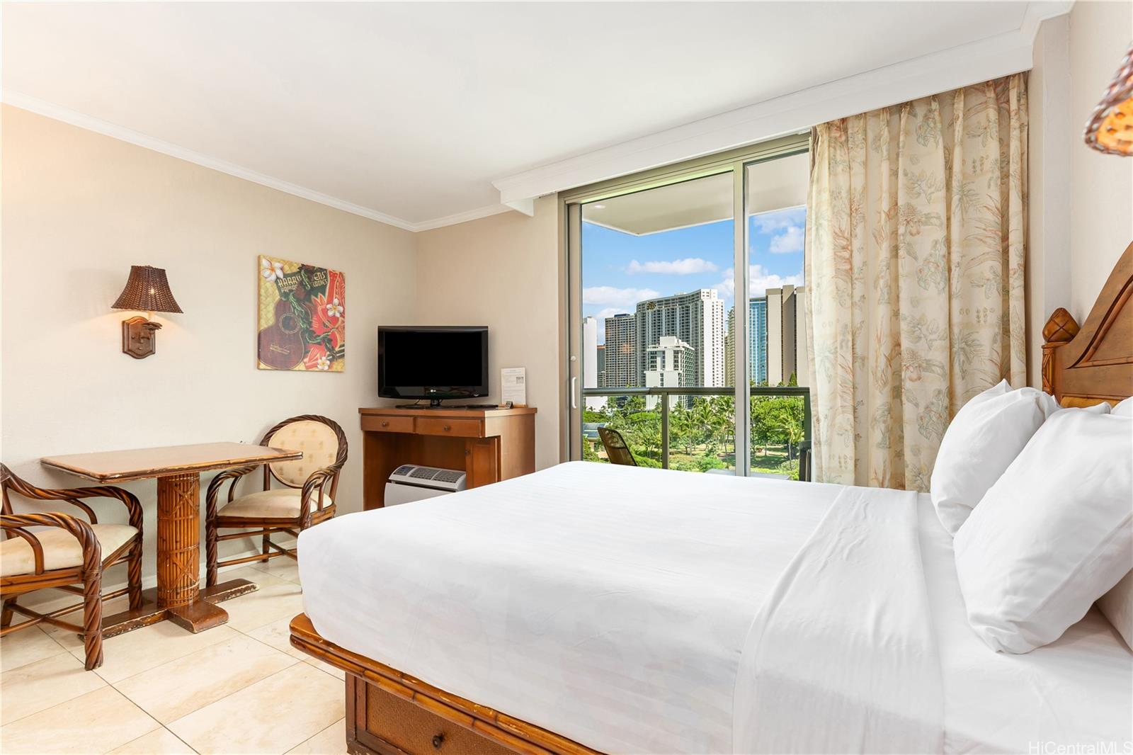 2045 Kalakaua Avenue, Unit 604 Honolulu, HI 96815 - Photo 5 of 24 a bedroom with a bed and a flat screen tv