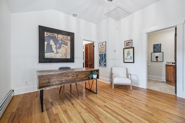 a view of a livingroom with furniture and wooden floor