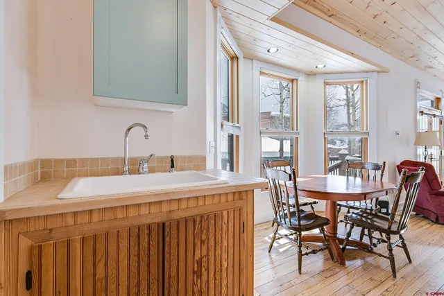 a view of a livingroom with furniture and entryway