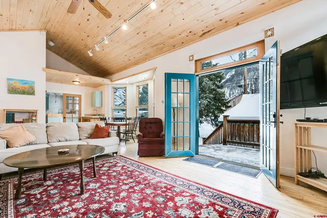 a bedroom with a bed table and a window