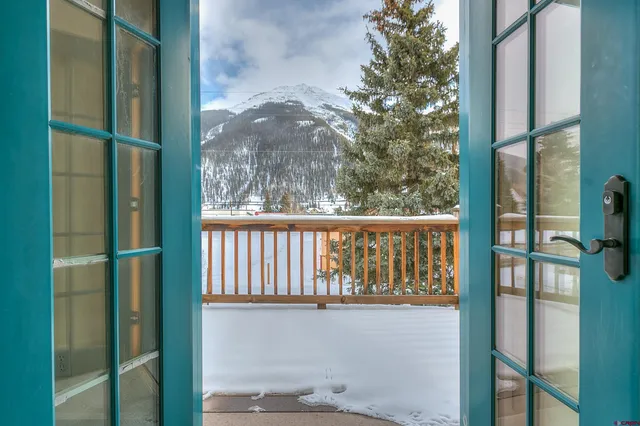 a bathroom with a bathtub and mirror