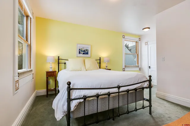 a view of a room with chairs and a window