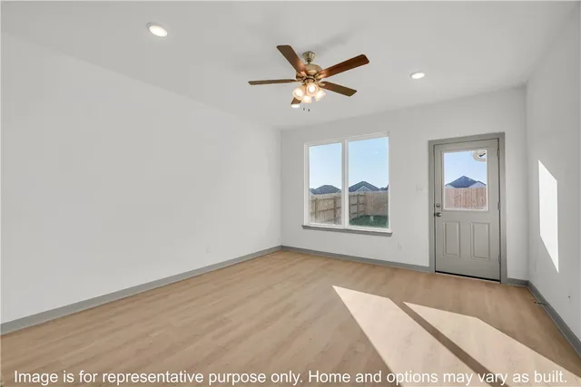 a view of an empty room and window