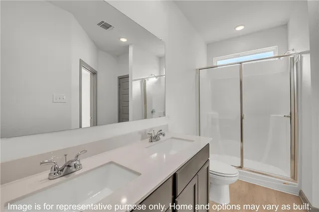 a bathroom with a granite countertop sink mirror and double