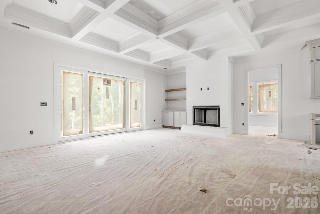5117 Grassy Creek Road Denver, NC 28037 - Photo 3 of 13 a view of empty room with wooden floor and fan