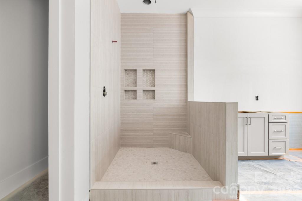 5117 Grassy Creek Road Denver, NC 28037 - Photo 5 of 13 a bathroom with a bath tub