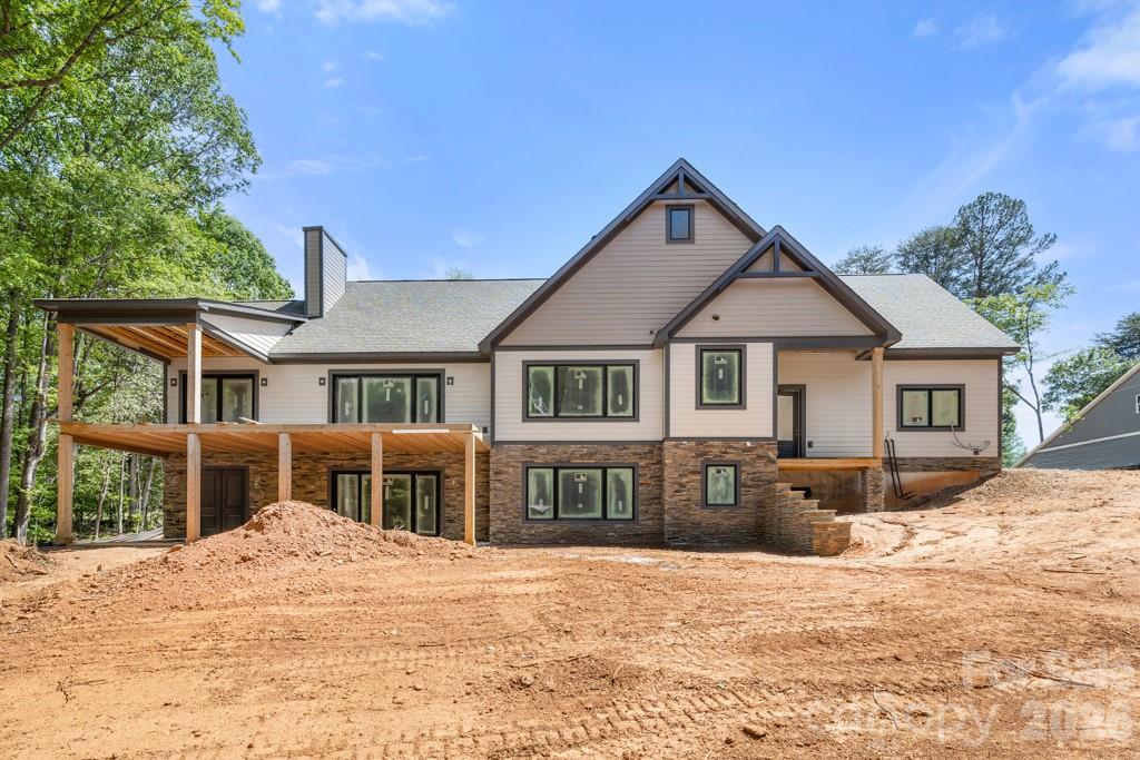 5117 Grassy Creek Road Denver, NC 28037 - Photo 8 of 13 a front view of a house with a yard
