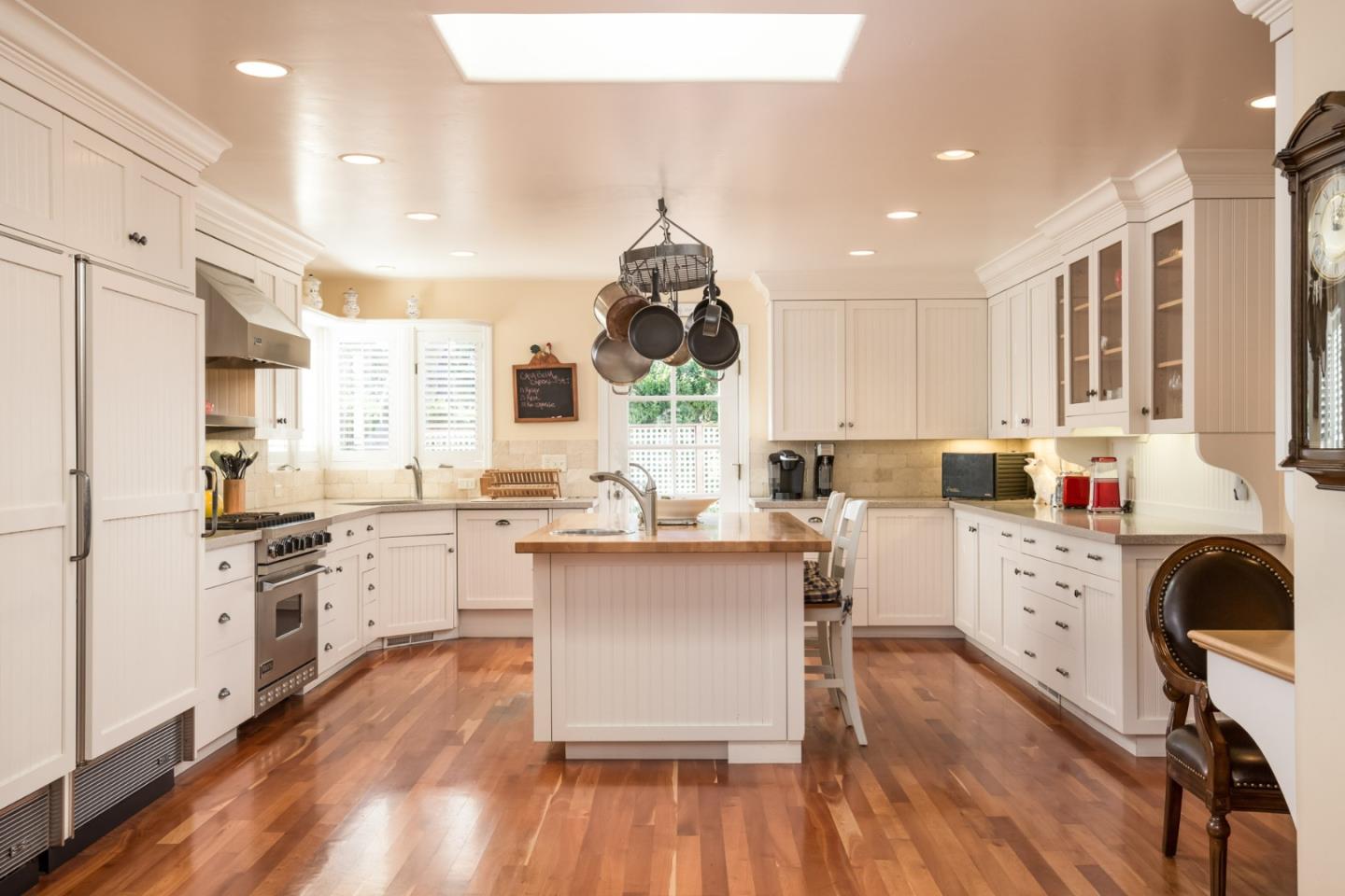 25064 Hatton Road Carmel, CA 93923 - Photo 11 of 21 a kitchen with white cabinets and white appliances