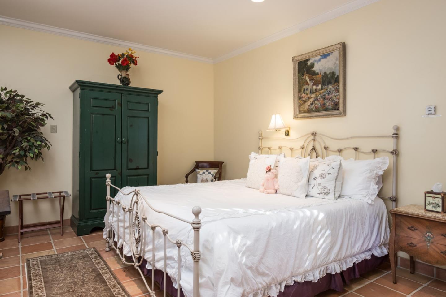 25064 Hatton Road Carmel, CA 93923 - Photo 20 of 21 a bedroom with bed and cabinets