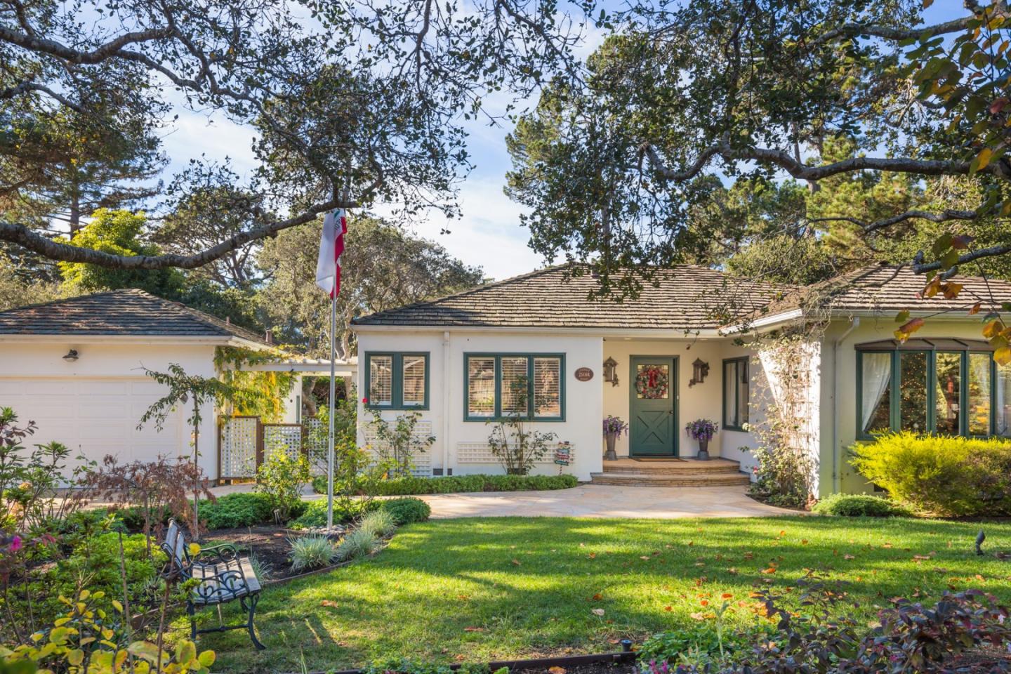 25064 Hatton Road Carmel, CA 93923 - Photo 2 of 21 a front view of house with yard and green space