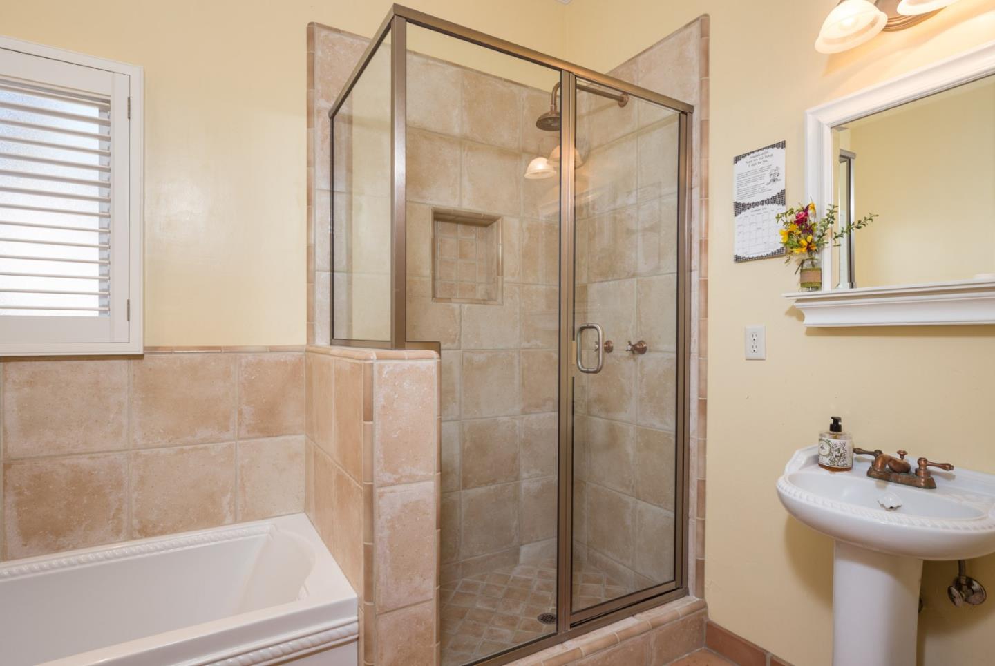 25064 Hatton Road Carmel, CA 93923 - Photo 21 of 21 a bathroom with a sink mirror and shower