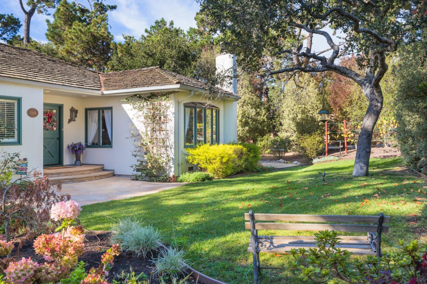 25064 Hatton Road Carmel, CA 93923 - Photo 4 of 21 a front view of a house with garden