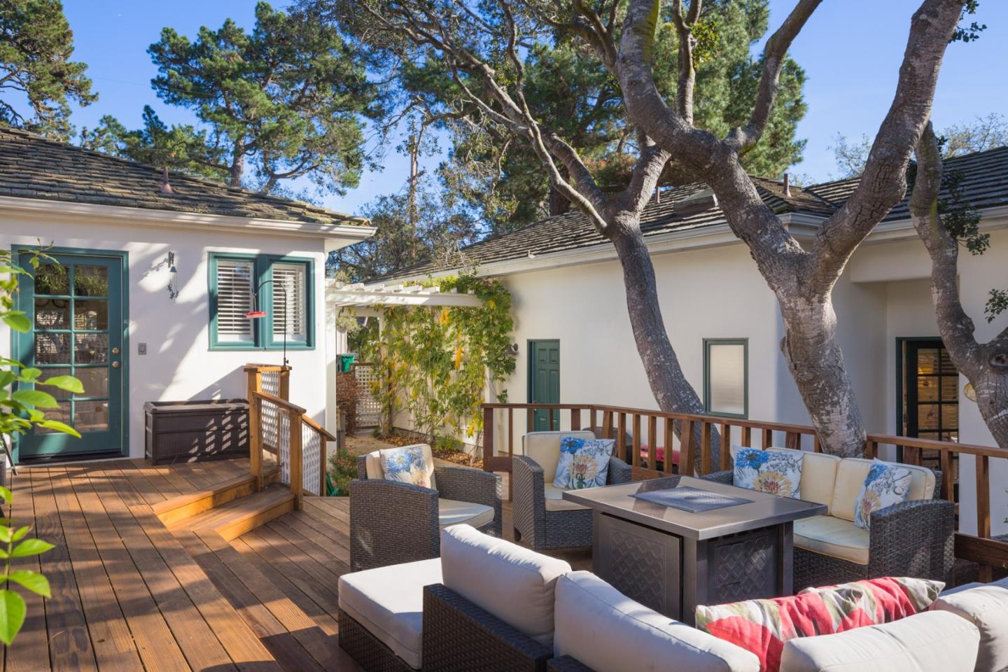 25064 Hatton Road Carmel, CA 93923 - Photo 5 of 21 a view of a patio with couches table and chairs and potted plants