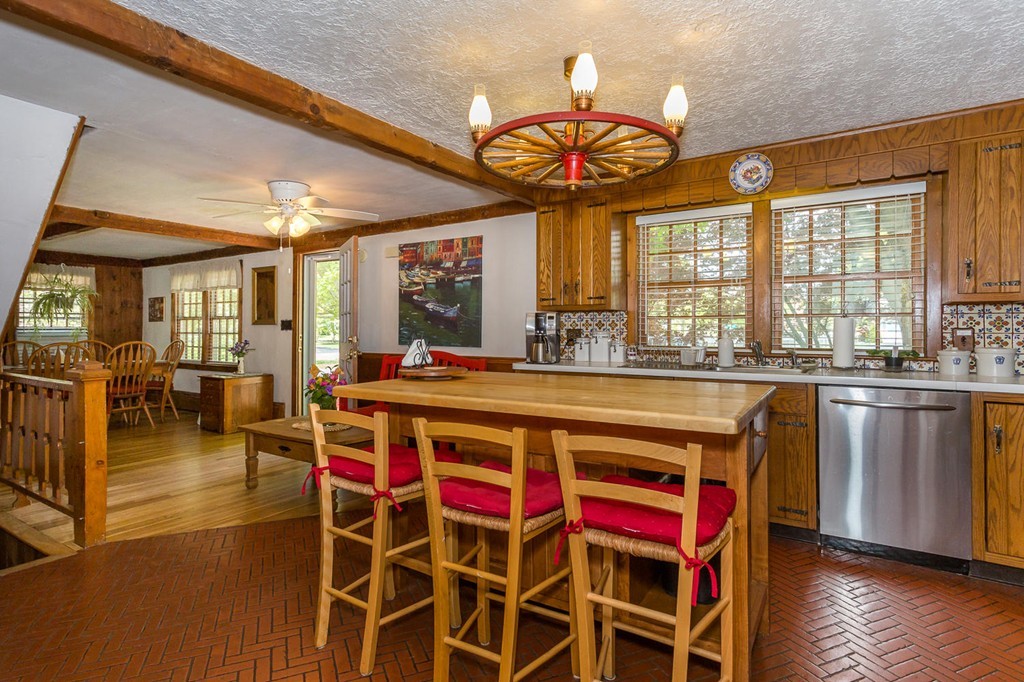 34 Independence Street Canton, MA 02021 - Photo 3 of 29 a large kitchen with a table and chairs