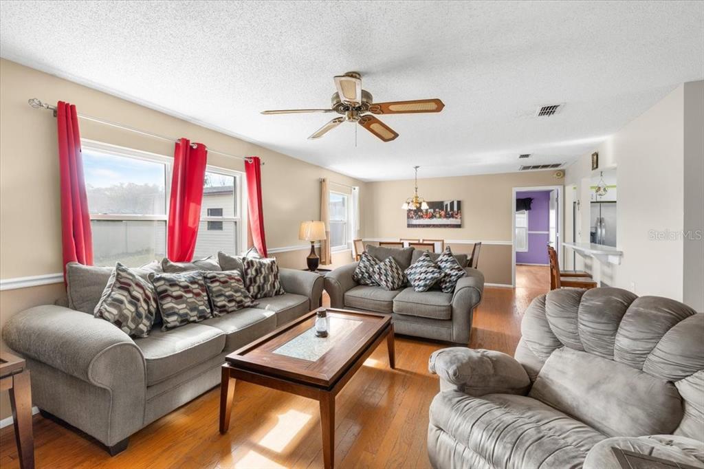 10290 Bannock Street Spring Hill, FL 34608 - Photo 11 of 40 a living room with furniture and a large window