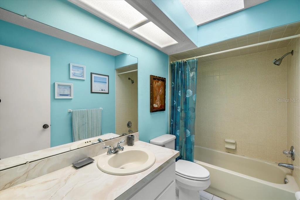 10290 Bannock Street Spring Hill, FL 34608 - Photo 20 of 40 a bathroom with a sink toilet and shower