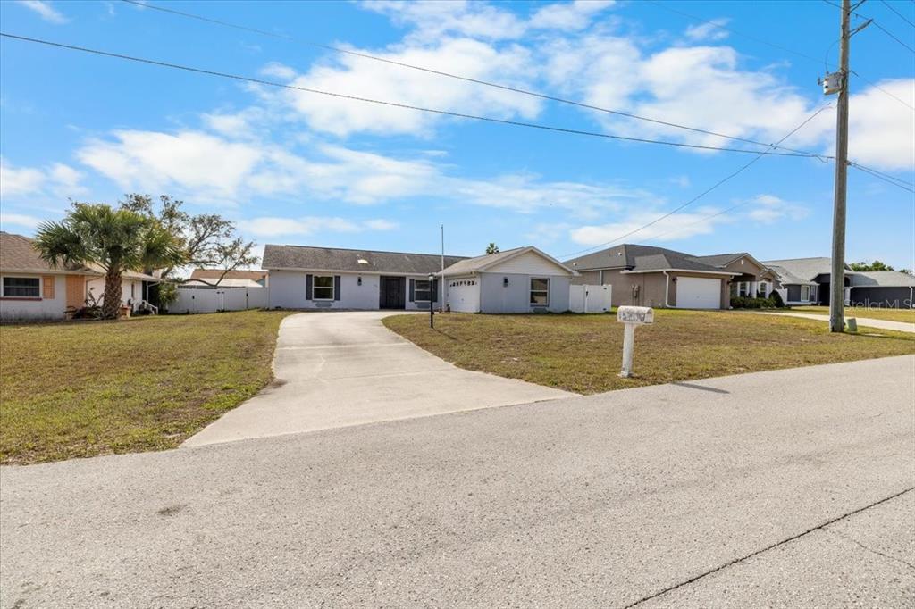 10290 Bannock Street Spring Hill, FL 34608 - Photo 2 of 40 a view of house with outdoor space and seating area
