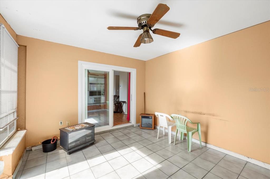 10290 Bannock Street Spring Hill, FL 34608 - Photo 21 of 40 a living room with furniture and a window