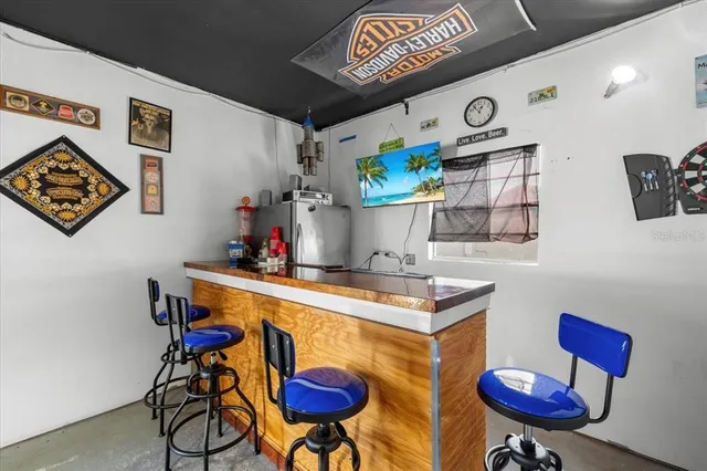 a view of a room with furniture and wooden floor